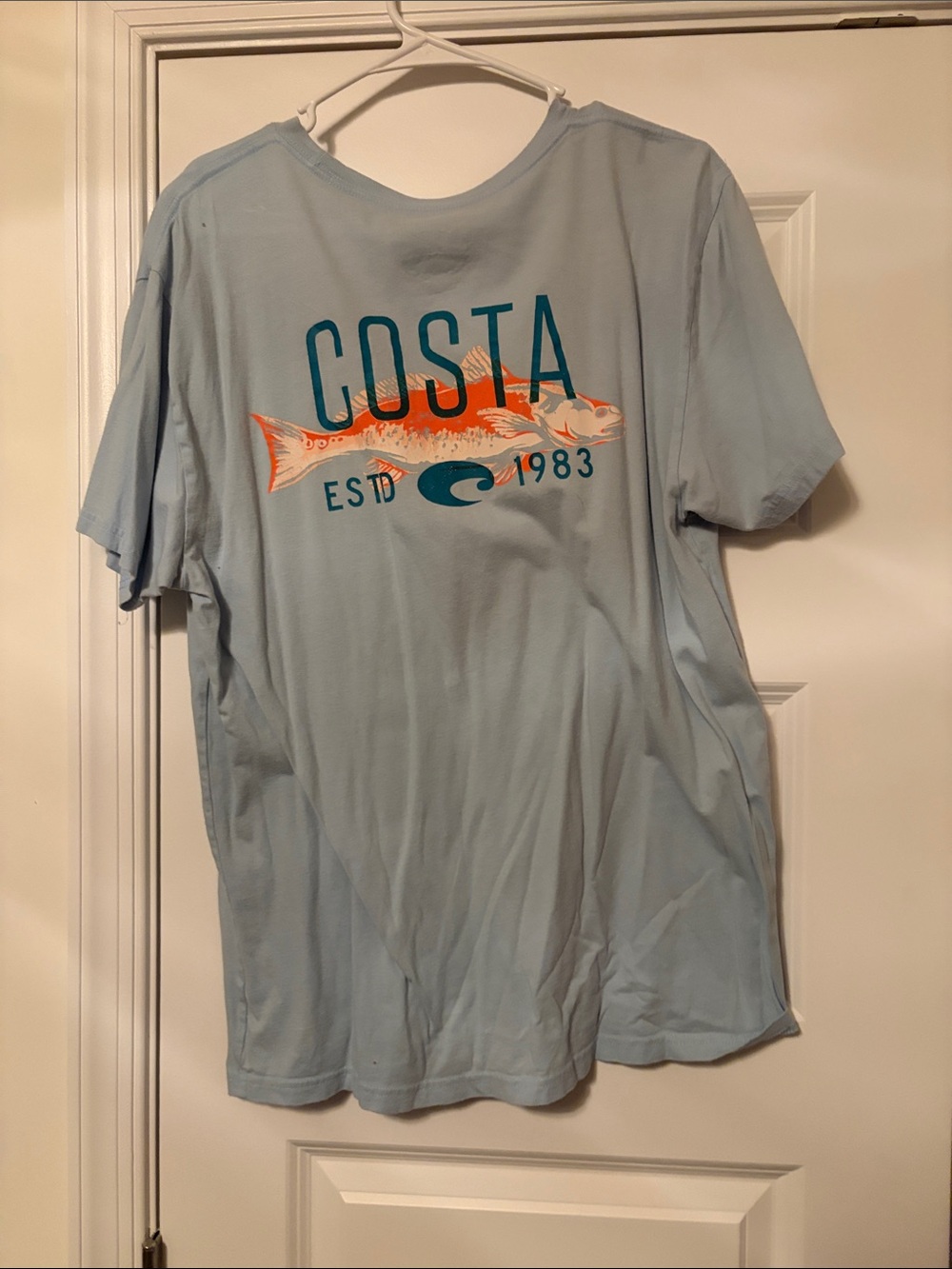 Costa Light Blue Short Sleeve Tee with Orange Fish Graphic
